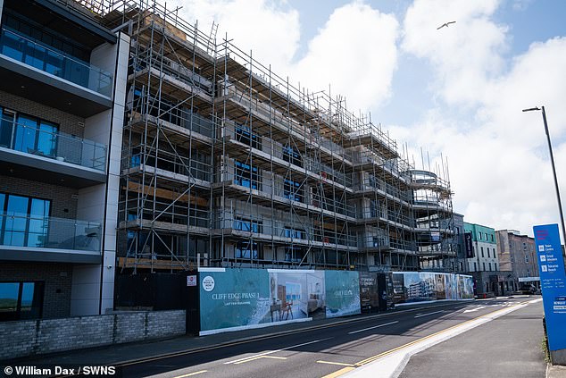 One resident claimed the development is not 'waterproof' and floods are 'routine in the basement, the electrical room and in some apartments'
