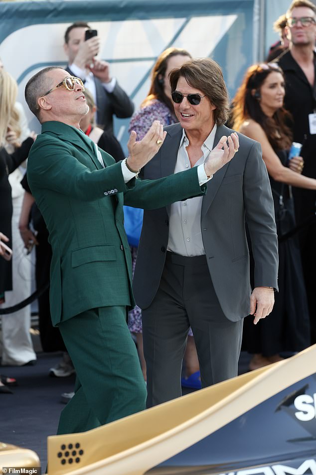 Mission Impossible star Tom donned a sleek, modern two-piece suit in a charcoal gray color. The suit features a tailored fit with a single-breasted jacket