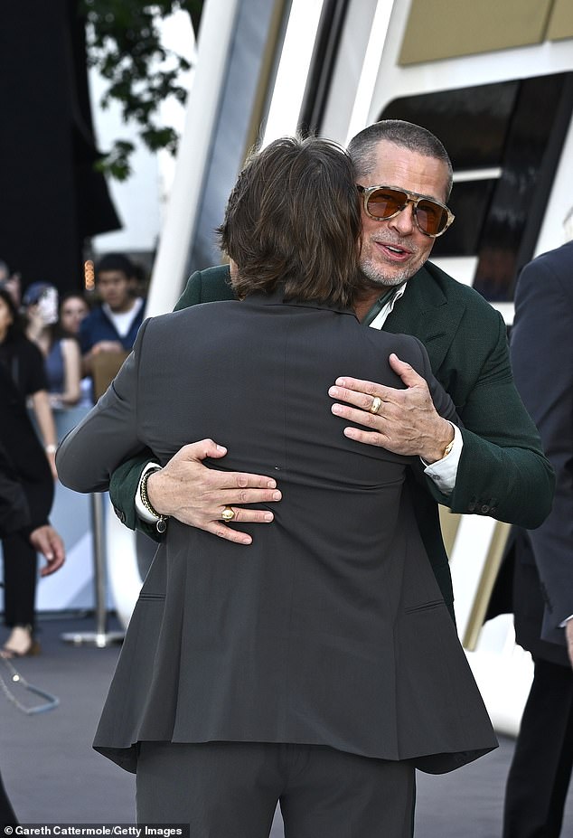The Hollywood actor, 61, was joined on the red carpet in Leicester Square by Tom, 62, as the movie hunks looked happy to see each other, greeting one another with a hug