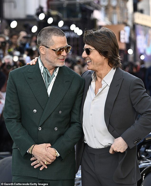 Brad showed off his buzzcut look as he posed with Mission Impossible star Tom for snaps