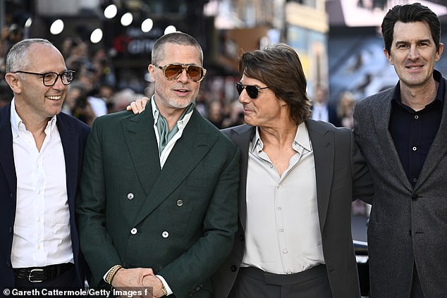 Stefano Domenicali, Brad Pitt, Tom Cruise and Joseph Kosinski pose for snaps on the F1 red carpet in London