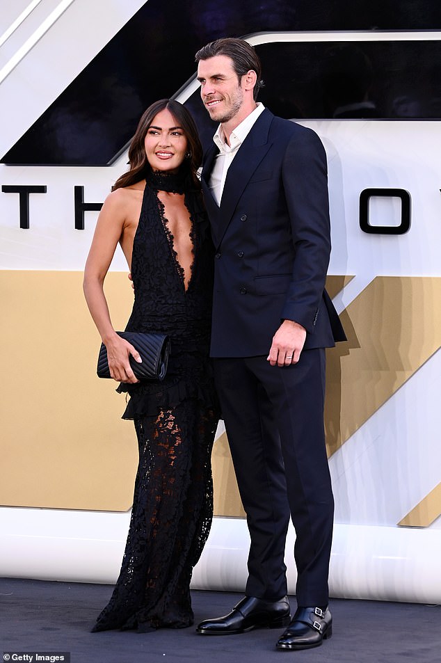 The retired Welsh footballer, 33, looked handsome in a black two-piece suit which he layered with a crisp white shirt