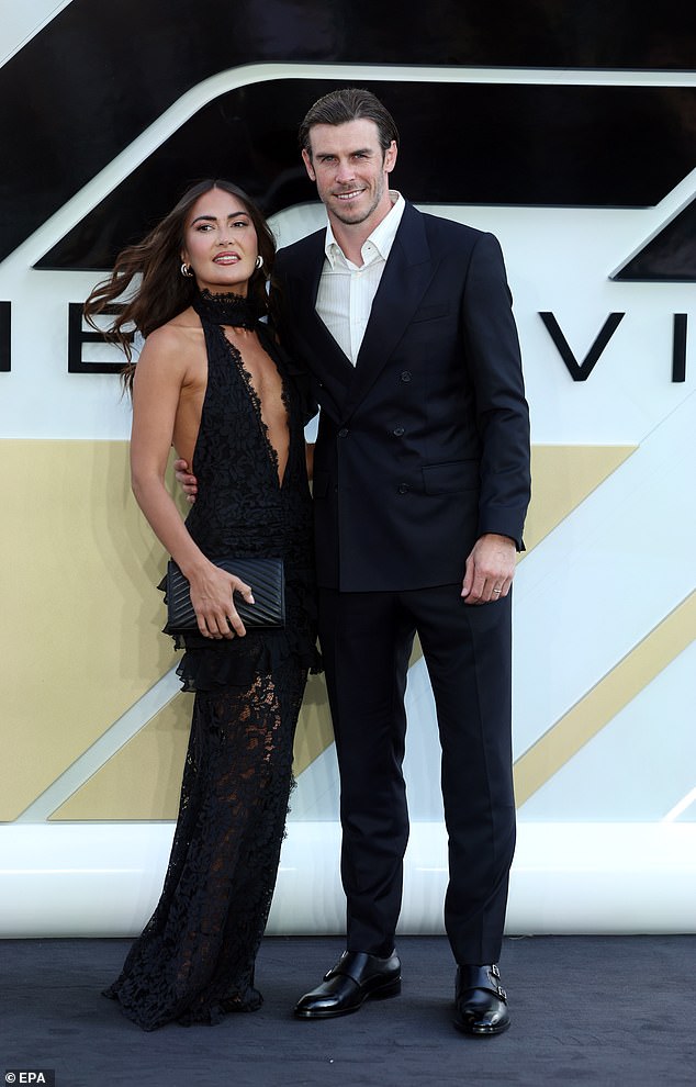 The Welshman, who recently announced his retirement from professional football, looked in happy spirits as he appeared on the carpet alongside his stunning wife
