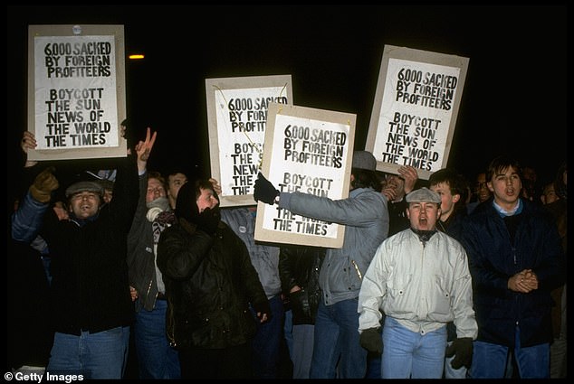 Printworkers demontrating on picket line outside newspaper owner Rupert Murdoch's Wapping, London, plant during strike