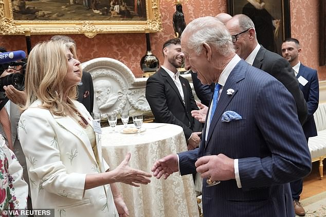 King Charles, pictured, spoke with stars including Kate Garraway during a reception this afternoon