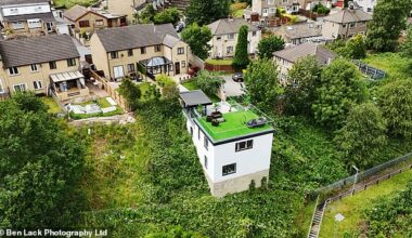 A builder who created a spectacular Grand Designs-style pad carved into a steep railway embankment has been ordered to tear it down