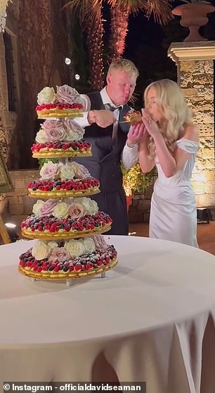 Ramsdale and his wife Georgina tuck into their cake