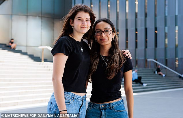 University students are racking up higher debts and taking longer to pay them off as wage growth slows in Australia (pictured, students are seen at Sydney University)