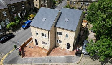 Neighbours will ¿buy popcorn¿ and watch from their windows if bulldozers move in to tear down two huge homes, pictured ¿ after it emerged they were built without planning permission