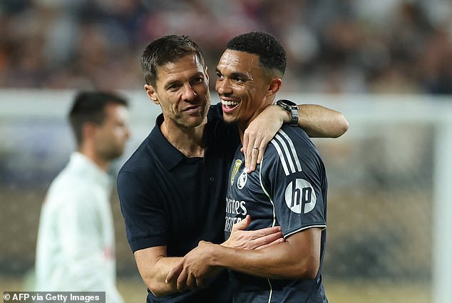 Trent Alexander-Arnold shares a laugh with his new manager Xabi Alonso at full-time