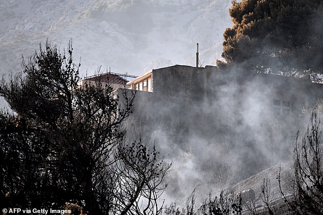 CROATIA: This photograph shows a partialy burnt house during a wildfire near the coastal town of Omis on June 21