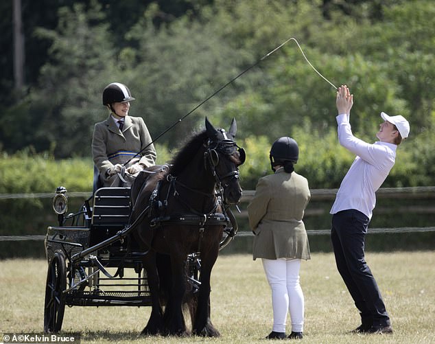 They appeared relaxed in one another company on Friday, with both smiling as they chatted together. During one jovial moment, Louise appeared to dangle her whip into the air for Felix to clap between his hands