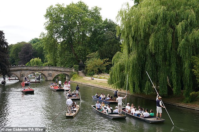 CAMBRIDGE -- People punting along the River Cam, as the warm weather continues
