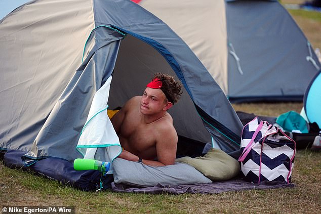 A spectator in the overnight on day one of the 2025 Wimbledon Championships at the All England Lawn Tennis and Croquet Club, London