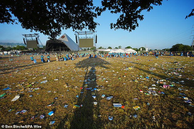Glastonbury clean up this morning as the sun starts to creep through