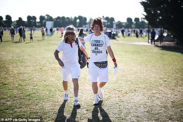 Tennis fans dressed as Sweden's tennis player Bjorn Borg (L) and US tennis player John McEnroe (R)