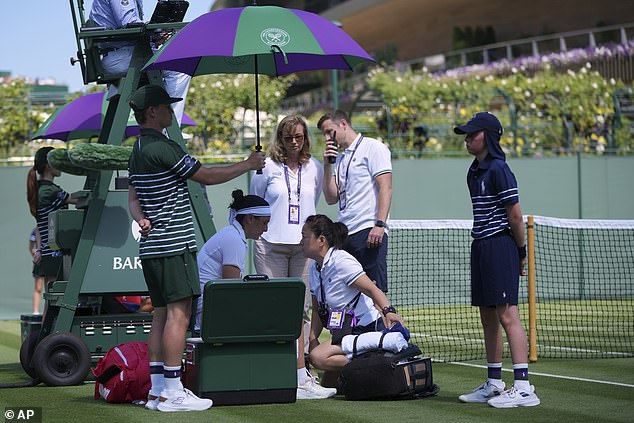 Ons Jabeur of Tunisia get medical assistance during her match against Varvara Gracheva of France at the first round singles match