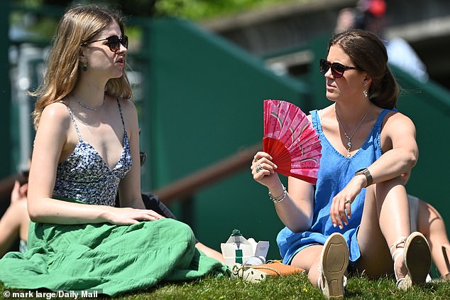Fans come prepared with fans to help manage the heat