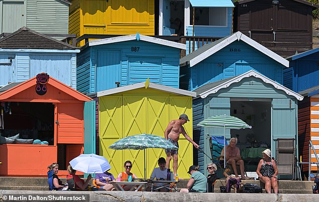 With the heatwave temperature approaching 34C visitors enjoy the weather at the Essex coastal town of Walton