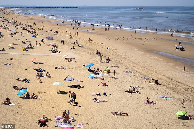 A beach in the Netherlands where sunseekers are trying to escape the soaring temperatures