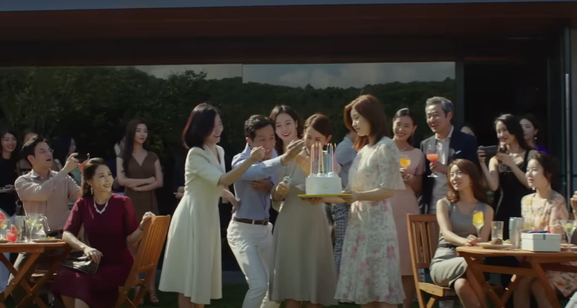 A group of guests at a birthday party during Parasite, one of the best movies on HBO Max.