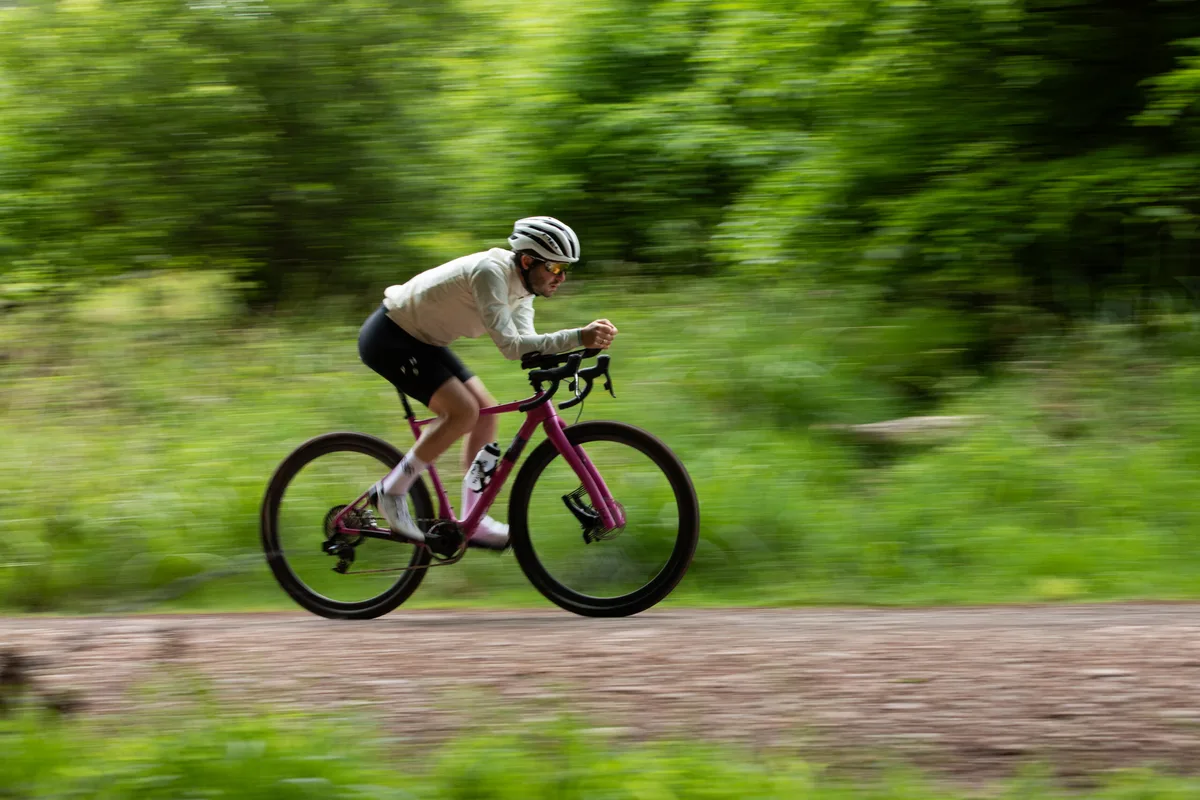 Liam Cahill riding in aero bars on pink Lauf gravel bike