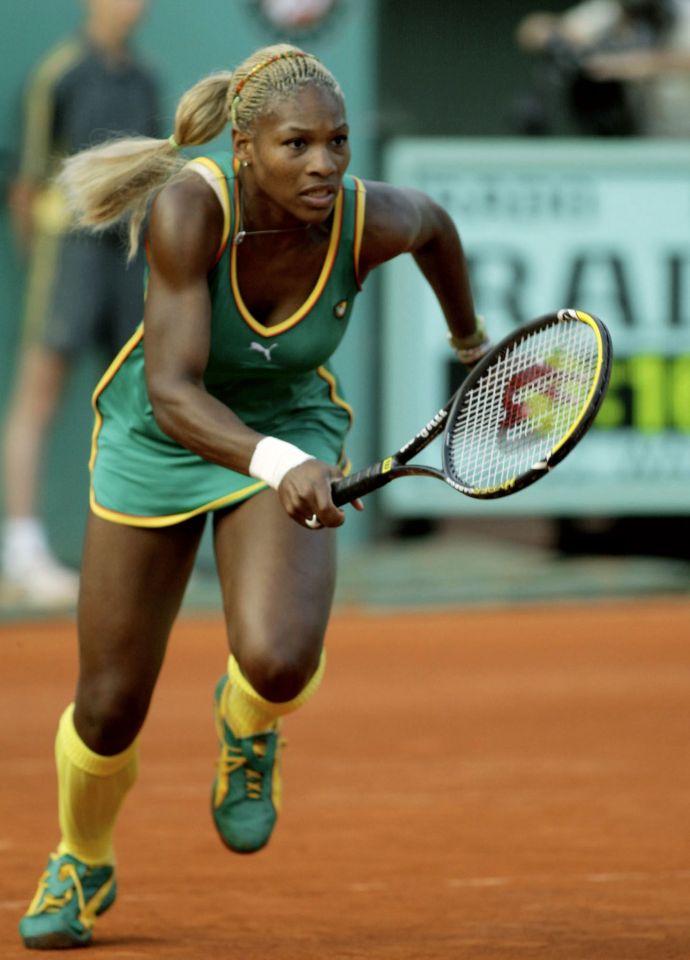 PARIS, FRANCE:  US Serena Williams runs to the net during the match against her Madagascan opponent Dally Randriantefy, 30 May 2002 in Paris, during a Roland-Garros French Open second round match. Serena Williams won 6-2, 6-3. (Photo credit should read FRANCOIS GUILLOT/AFP via Getty Images)