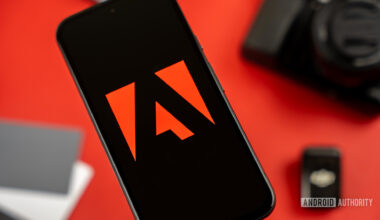 Adobe logo on smartphone, next to photography and videography products stock photo (6)