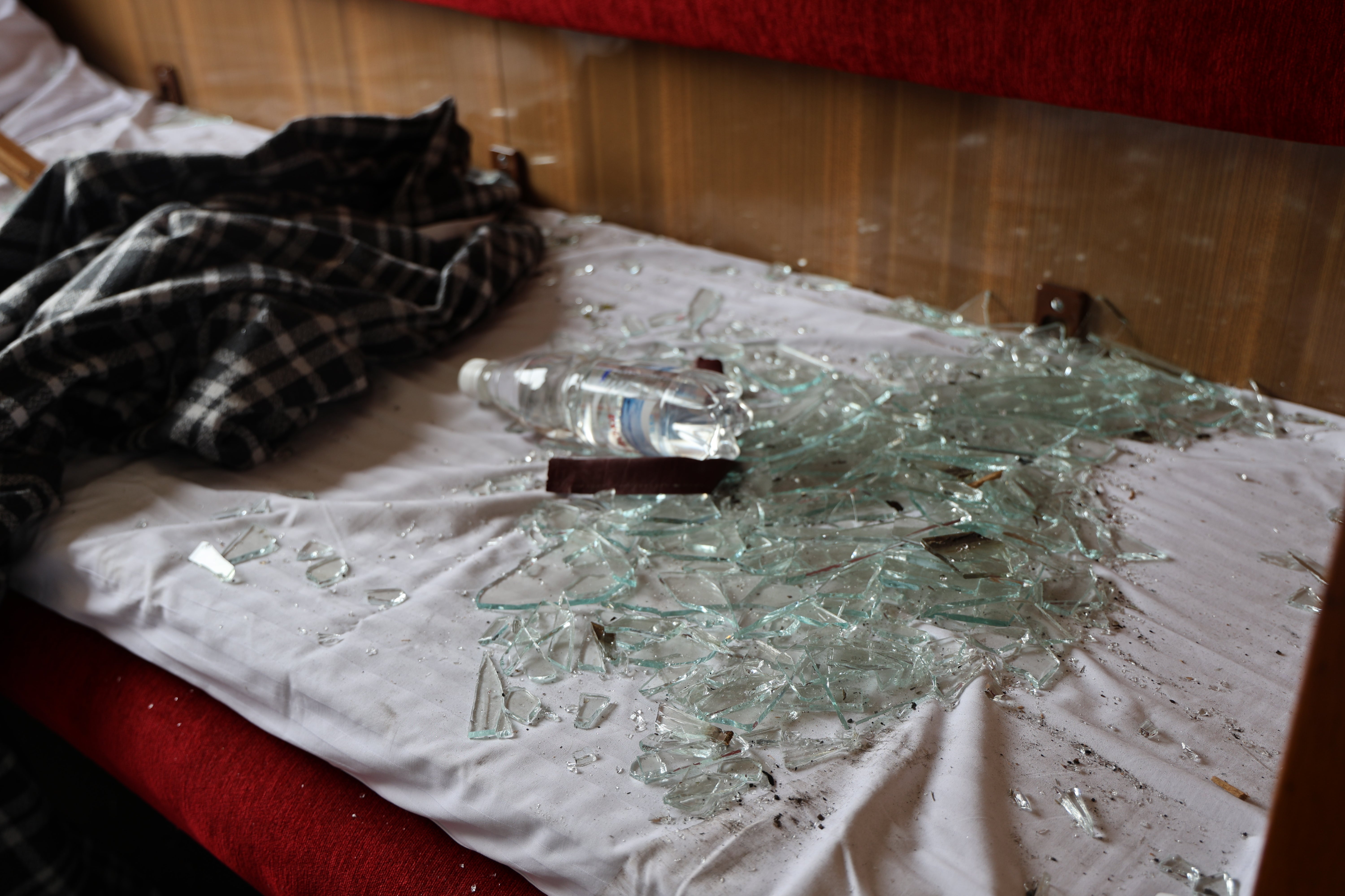 Shattered glasses are seen in a damaged sleeper train after Russian ballistic missile attacks on Dnipro and Samar