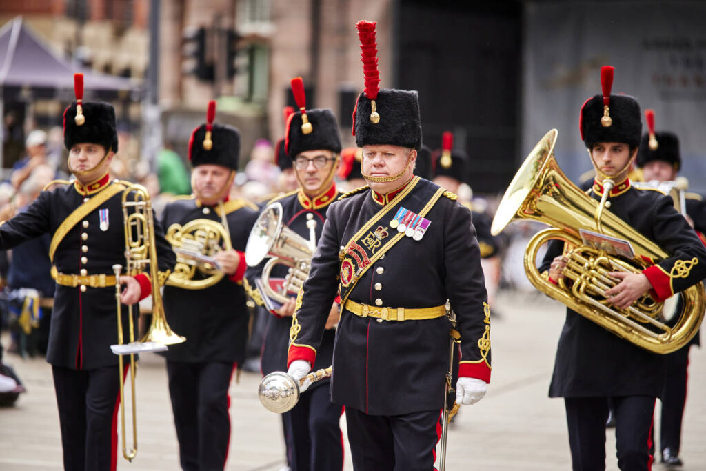 armed forces day parade through manchester with artillery band