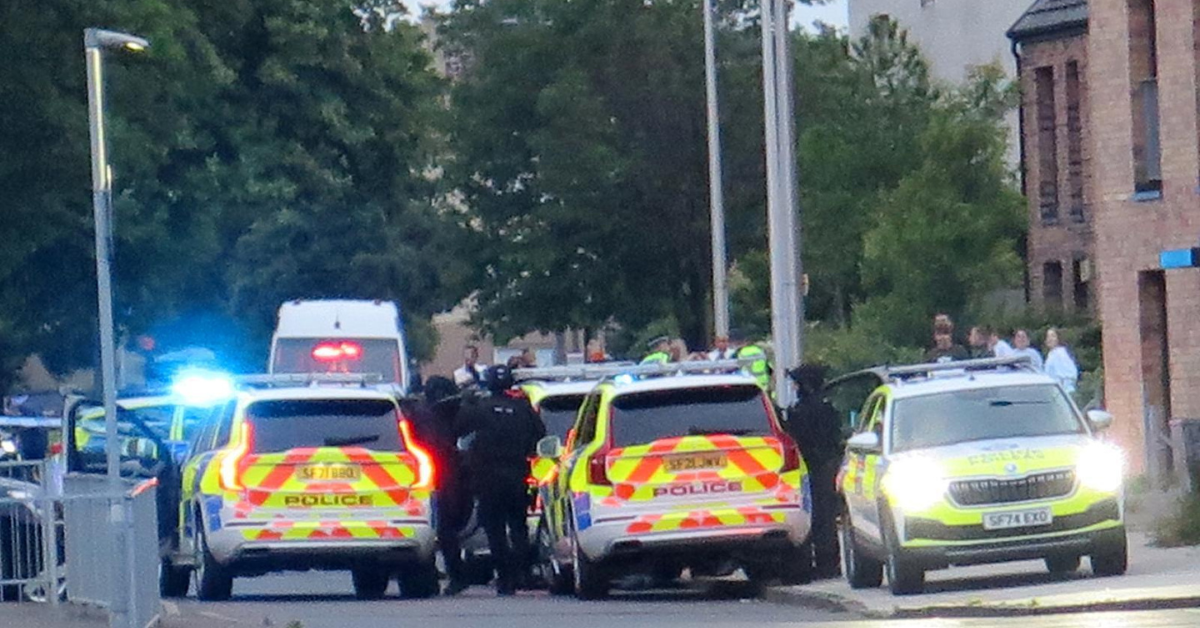 Armed cops swarm Scots street amid ongoing incident as road locked down