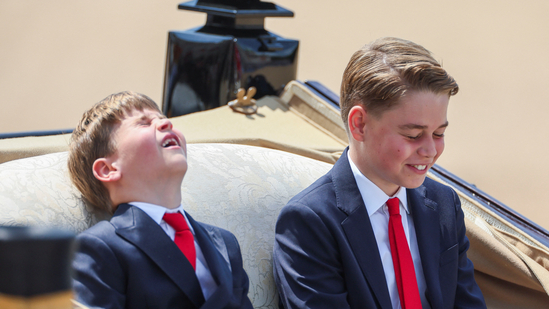Britain's Prince George and Prince Louis react as they ride a carriage with Britain's Catherine, Princess of Wales, and Princess Charlotte (not pictured) as part of the Trooping the Colour parade which honours Britain's King Charles on his official birthday, in London, Britain, June 14, 2025. REUTERS/Isabel Infantes(REUTERS)