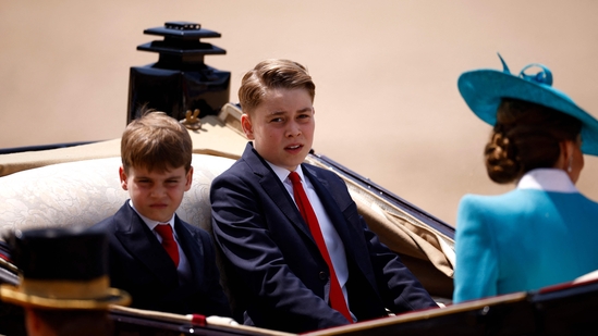 (L-R) Britain's Prince Louis of Wales, Britain's Prince George of Wales and Britain's Catherine, Princess of Wales, make their way back to Buckingham Palace from Horse Guards Parade during the King's Birthday Parade, "Trooping the Colour", in London on June 14, 2025. The ceremony of Trooping the Colour is believed to have first been performed during the reign of King Charles II. Since 1748, the Trooping of the Colour has marked the official birthday of the British Sovereign. Over 1500 parading soldiers and almost 300 horses take part in the event. (Photo by BENJAMIN CREMEL / AFP)(AFP)
