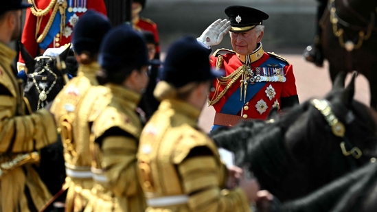 Britain's King Charles III salutes members of the royal guard during the King's Birthday Parade "Trooping the Colour" in London on June 14, 2025. The ceremony of Trooping the Colour is believed to have first been performed during the reign of King Charles II. Since 1748, the Trooping of the Colour has marked the official birthday of the British Sovereign. Over 1500 parading soldiers and almost 300 horses take part in the event. (Photo by Ben STANSALL / AFP)(AFP)