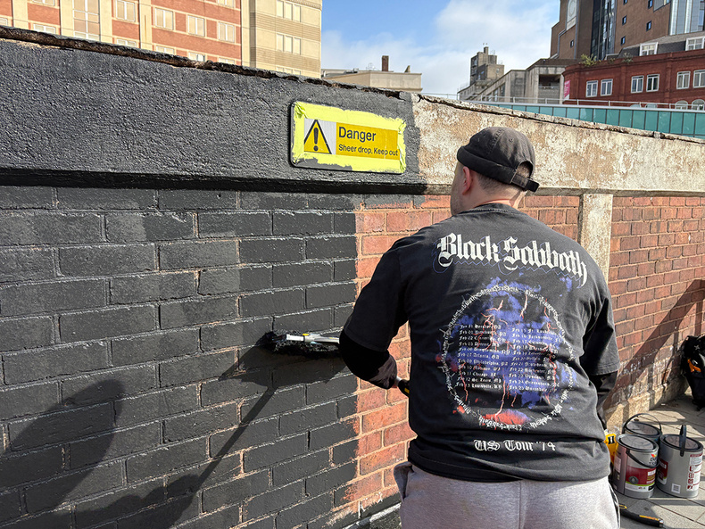 Mr Murals painting a Black Sabbath mural