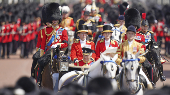 Prince William, left rides in the Royal Procession down the Mall during the Trooping the Colour in London, Saturday, June 14, 2025, the prince is wearing a black armband as a mark of respect to the victims of the Air India plane crash.(AP Photo/Alberto Pezzali)(AP)
