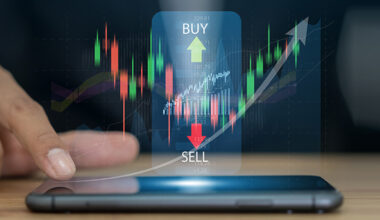 Successful of trader use phone trading stock exchange graph money, global economic, trader investor,graph money of block chain stock market cryptocurrency selling and buy with price chart data graph