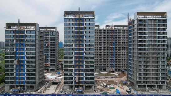 Residential buildings under construction by Chinese real estate developer Vanke in Hangzhou, in eastern China's Zhejiang province.(AFP)