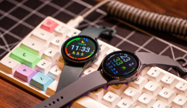 Samsung Galaxy Watch 5 vs Galaxy Watch 4 both screens on sitting atop keyboard