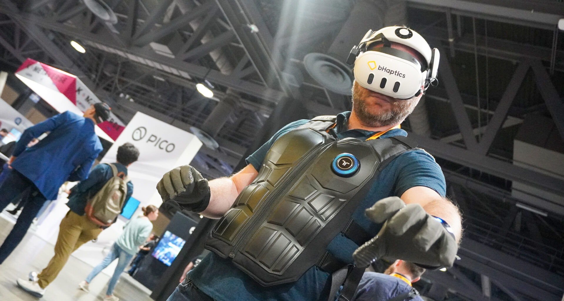 bHaptics Vr accessories: vest, gloves, sleeve with Meta headset at AWE 2025