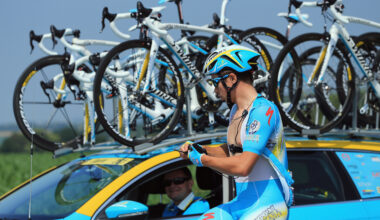 Rider in blue gets his radio replaced at the Tour de France