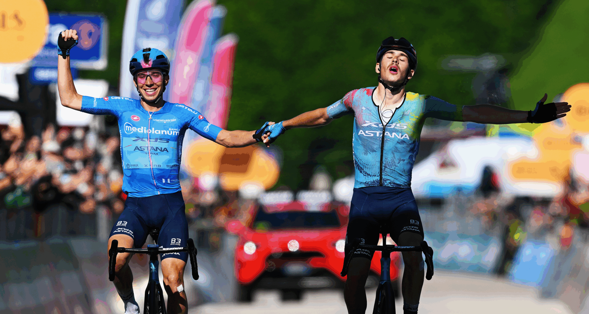 (L-R) Lorenzo Fortunato of Italy - Blue Mountain Jersey as second place and the stage winner Christian Scaroni of Italy and Team XDS Astana crosses the finish line together and celebrate victory during the 108th Giro d'Italia 2025, Stage 16 a 203km stage from Piazzola sul Brenta to San Valentino (Brentonico) 1316m / #UCIWT / on May 27, 2025 in San Valentino, Italy. (Photo by Tim de Waele/Getty Images)
