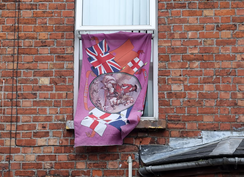Flags and bunting and other british emblems in the windows of homes in Ballymena following anti-migrant intimidation earlier this month. PICTURE: MAL MCCANN