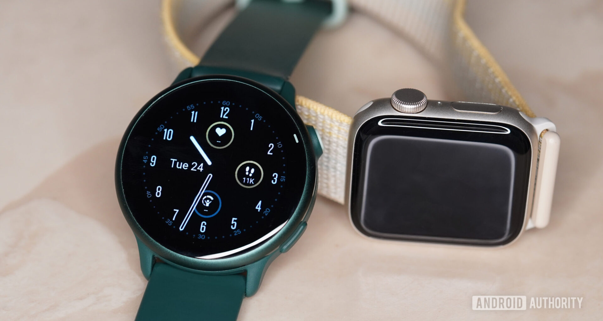 A Garmin Vivoactive 6 rests in front of an Apple Watch SE 2.