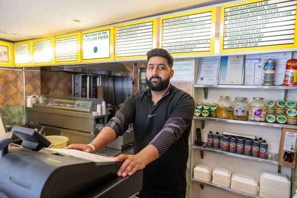 Gary Rai at the counter of his chippy