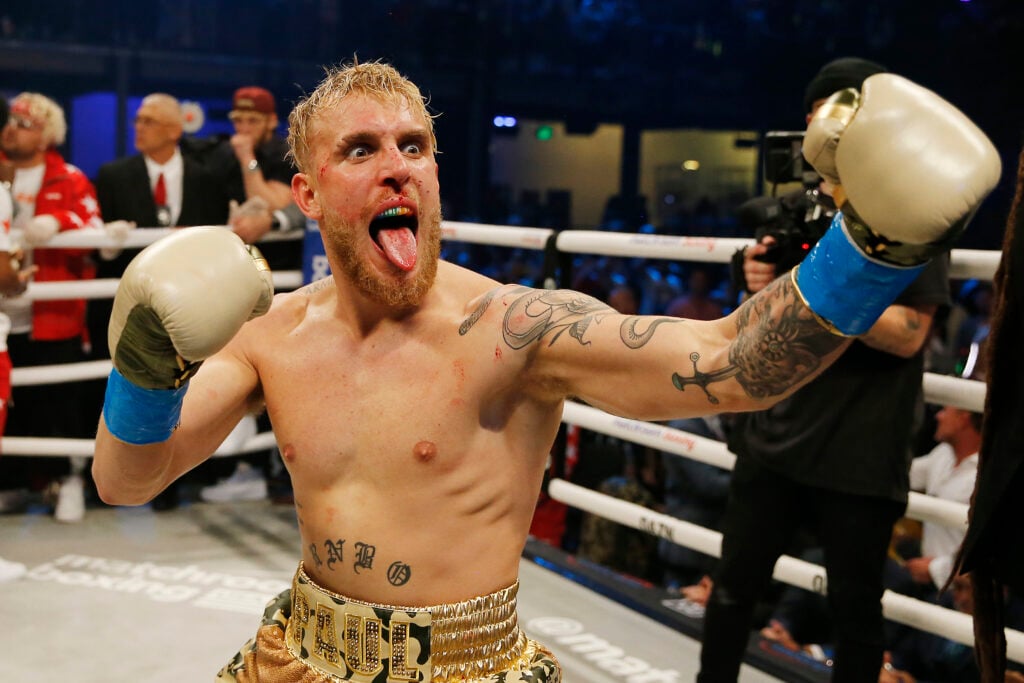 Jake Paul celebrates after defeating AnEsonGib in his professional boxing debut.