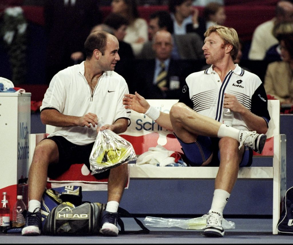 Andre Agassi of the USA talks to Boris Becker of Germany