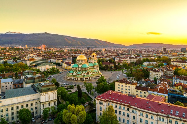Beautiful drone shot of downtown district of Sofia, Bulgaria, St. Alexader Nevski Cathedral in the middle, gold colored domes.