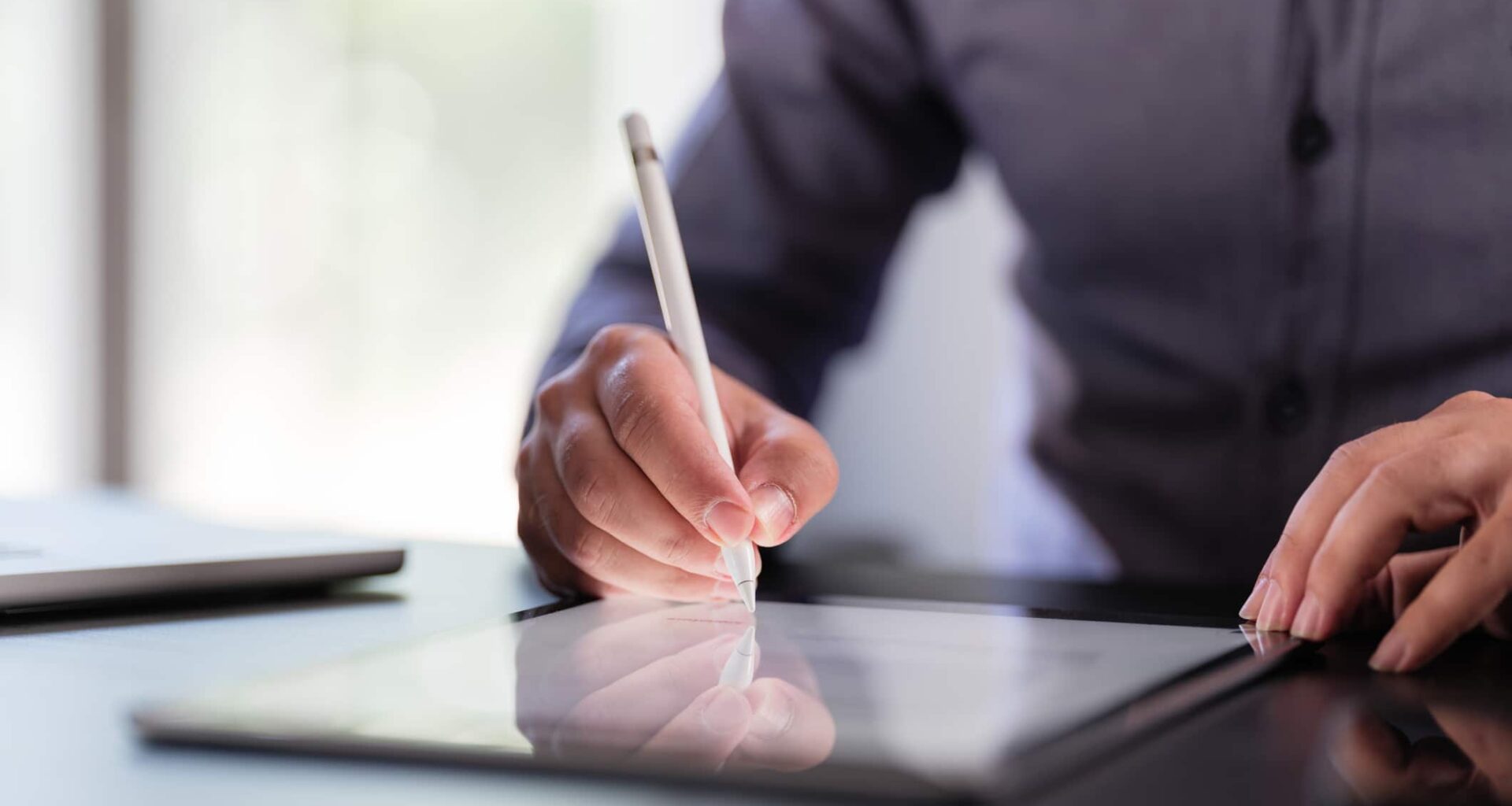 Businessman Signing Digital Contract On Tablet