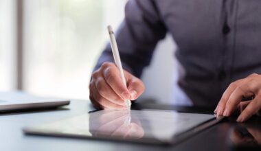 Businessman Signing Digital Contract On Tablet